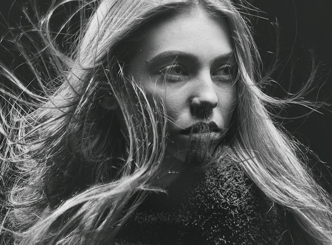 Studio portrait of a woman with long blonde hair