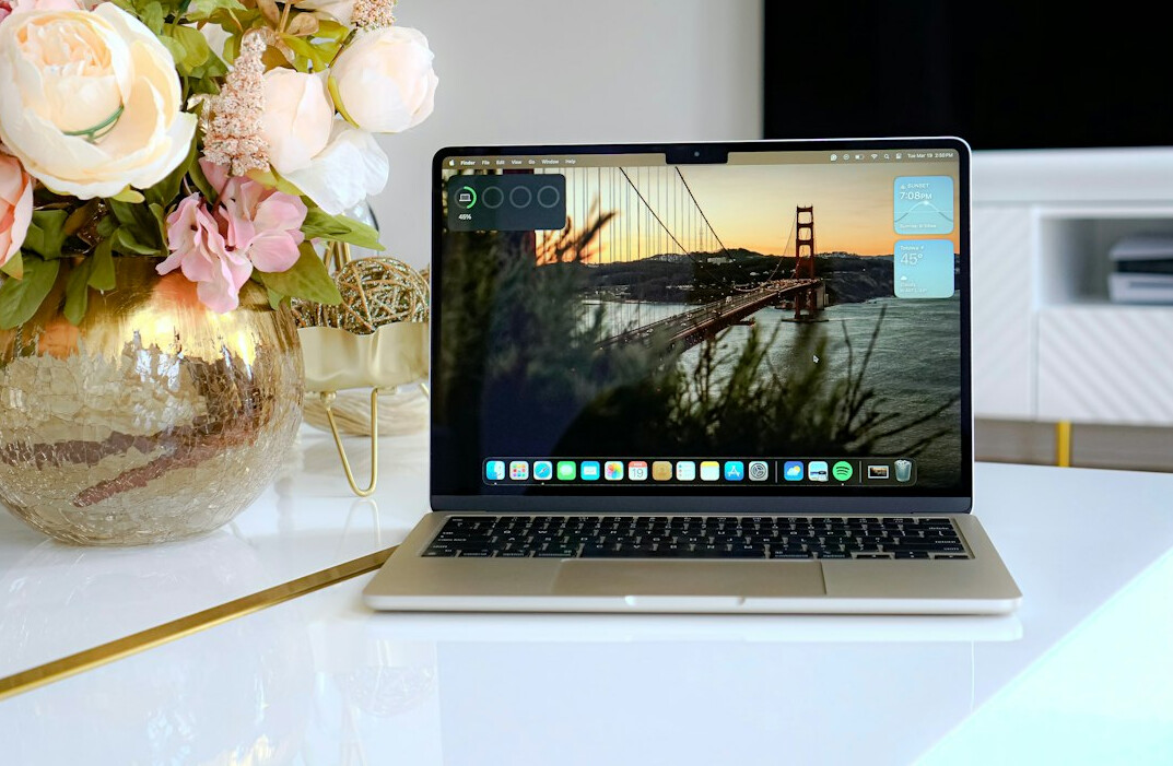 Person editing photographs on a laptop at a desk